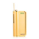 Front view of the Ooze Duplex dual extract vaporizer kit in sleek gold. This highly versatile, palm-sized device features an ergonomic trigger-style button to comfortably vaporize both thick concentrates and standard oil cartridges.
