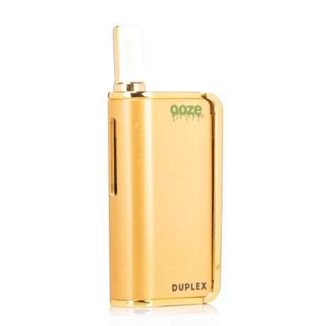 Front view of the Ooze Duplex dual extract vaporizer kit in sleek gold. This highly versatile, palm-sized device features an ergonomic trigger-style button to comfortably vaporize both thick concentrates and standard oil cartridges.