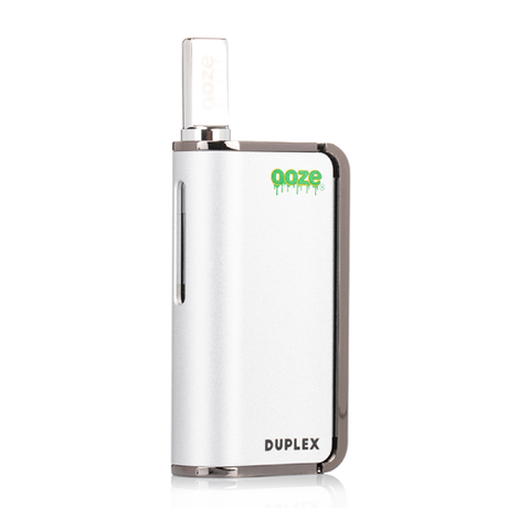 Front view of the Ooze Duplex dual extract vaporizer kit in sleek silver. This highly versatile, palm-sized device features an ergonomic trigger-style button to comfortably vaporize both thick concentrates and standard oil cartridges.