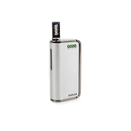 Front view of the Ooze Duplex dual extract vaporizer kit in sleek silver. This highly versatile, palm-sized device features an ergonomic trigger-style button to comfortably vaporize both thick concentrates and standard oil cartridges.