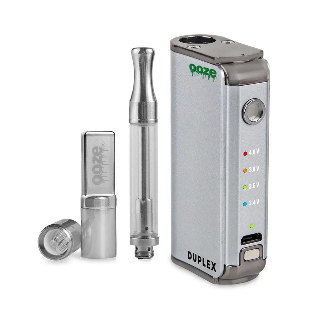 Front view of the Ooze Duplex Pro dual extract vaporizer kit in sleek silver. This upgraded palm-sized device features a concealed 510-thread chamber and a powerful C-Core Onyx atomizer to seamlessly handle both oil cartridges and raw extracts.