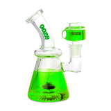 Front view of the Ooze Glyco Glycerin Freezable Water Pipe in Slime Green. This compact 6.5-inch borosilicate glass beaker bong features a hollow base filled with bright green freezable liquid glycerin to deliver incredibly cold, ice-like hits.