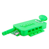 Front angled view of the Ooze Slugger Dugout Travel Kit in sleek green. This pocket-sized silicone travel piece neatly contains all your necessary concentrate accessories inside an impact-resistant, discreetly flat block.