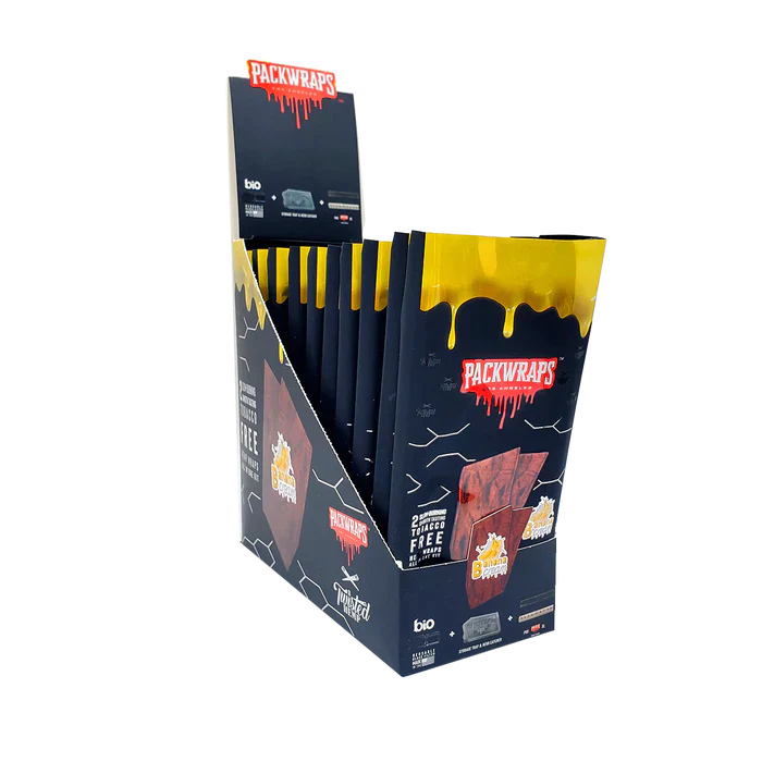 Front angled view of the Packwraps Twisted Hemp Wraps 10-count display box in black and yellow packaging. Produced in collaboration with Packwoods, these tobacco-free, slow-burning hemp wraps include a reusable glass tip and a Pro Packer XL tool for a premium rolling experience.