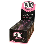Front view of the Pop Cones 1 1/4 flavored tips 24-count display box in assorted vibrant colors. This high-margin wholesale retail package contains premium ultra-thin pre-rolled cones featuring an innovative squeeze-and-pop flavor bead in the filter.