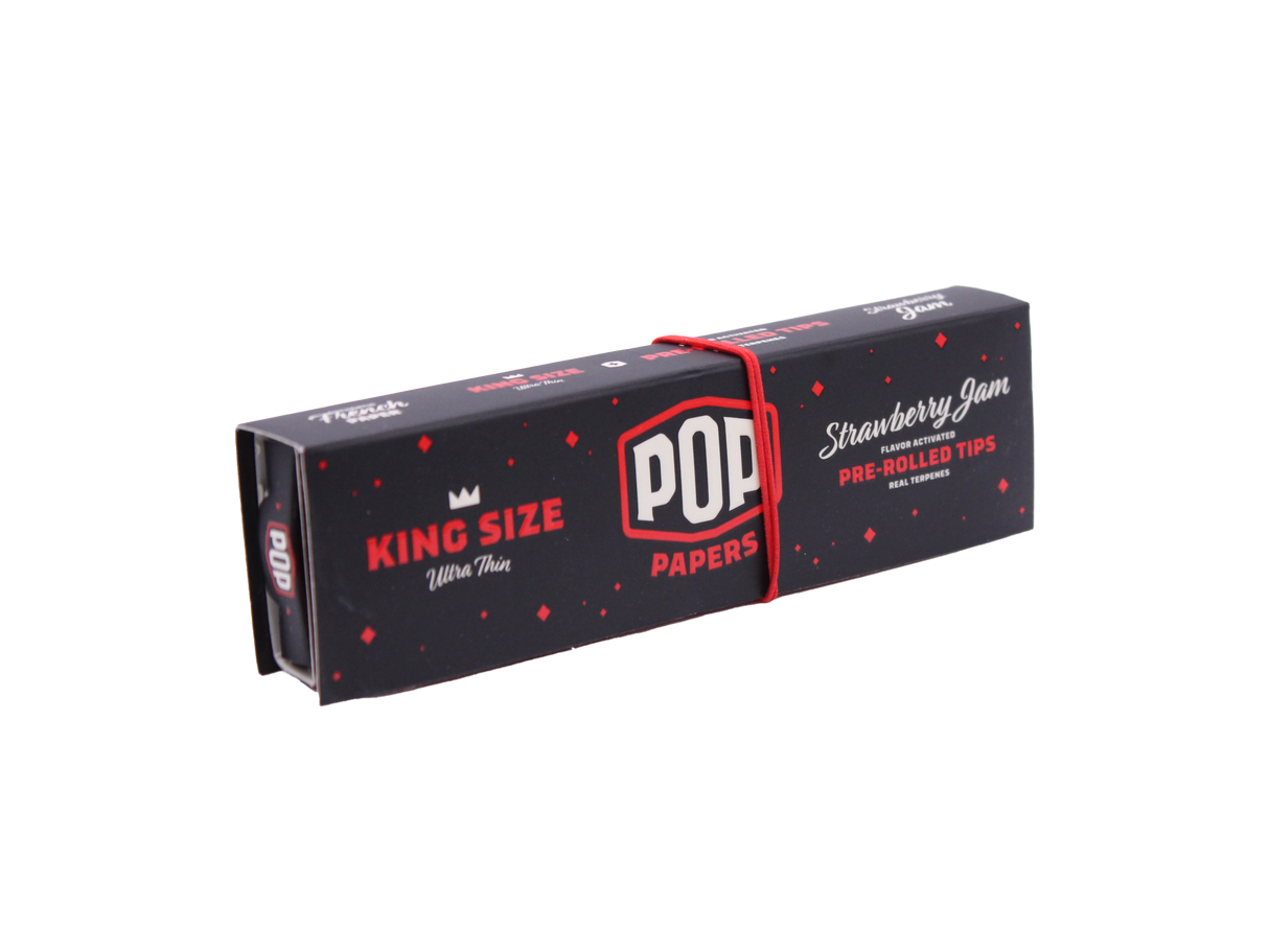 Angled overhead view of the red POP Papers Strawberry Jam booklet. The crushable filter beads are filled with fruit-derived terpenes for customized taste.