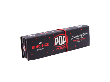 Angled overhead view of the red POP Papers Strawberry Jam booklet. The crushable filter beads are filled with fruit-derived terpenes for customized taste.