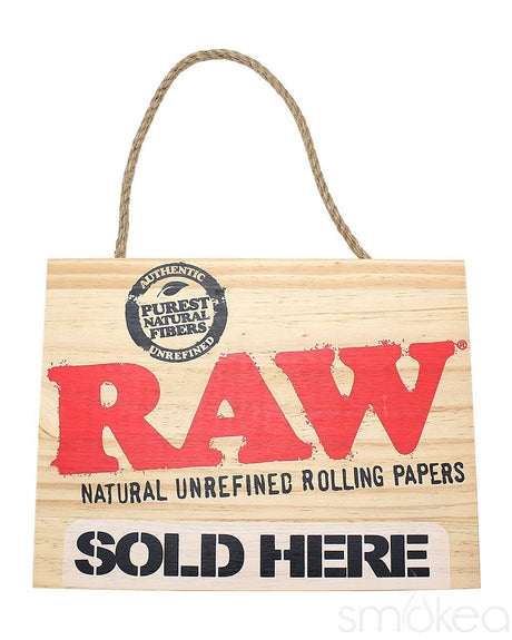 a front view of the RAW sold here sign. A authentic and collectible wall decor from RAW.