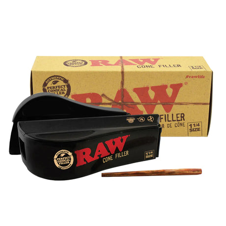 Front overhead view of the RAW 1 1/4 Size Cone Filler Machine in classic smoke-tinted translucent brown plastic with a bold red RAW logo. This mechanical roller lets you pack your favorite dry herb blends into a 1 1/4 sized pre-rolled cone with zero mess.