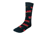 Front angled view of the RAW Black Crew Socks Hemp Blend Apparel laid flat. These premium mid-calf crew socks feature a comfortable, breathable hemp-cotton blend fabric with the signature red RAW logo boldly knitted near the top cuff.