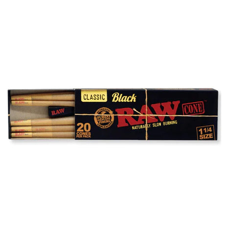 Front flat lay view of a single RAW Black Pre-Rolled Cones 1 1/4 Size 20-pack in black and gold cardboard packaging. This convenient slide-box gives frequent smokers an ample supply of RAW's thinnest unbleached cones for their daily sessions.