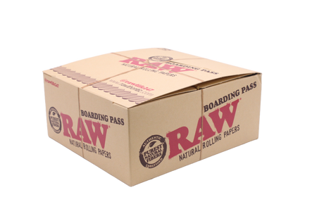 Angled overhead view of the open RAW boarding pass portable tray display in brown and tan. These compact rolling trays feature raised, curved edges to neatly contain materials and prevent tabletop spills.