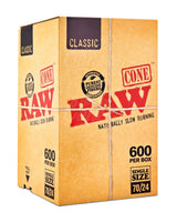 Front angled view of the RAW Classic Dogwalker 70/24 Bulk Cones 600-count box in natural kraft brown packaging. Measuring 70mm in length with a 24mm tip, these unbleached, mini-sized cones provide slightly more packable space for quick, personal smoke sessions.