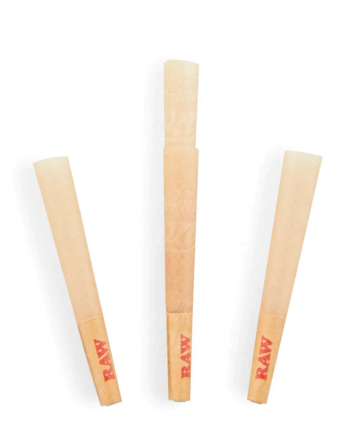 Close-up angled view of the RAW Classic Dogwalker Cone's 24mm unrefined paper filter tip in light brown. The built-in W-fold filter prevents loose herbs from pulling through into the mouth while maintaining optimal airflow during quick sessions.