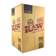 Front angled view of the RAW Classic Dogwalker 70/30 Bulk Cones 500-count box in natural kraft brown packaging. Measuring 70mm in length with a 30mm tip, these unbleached, mini-sized cones are perfectly proportioned for quick, individual smoke sessions.
