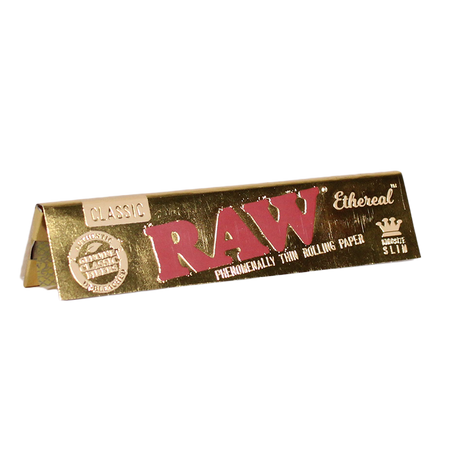 Front view of a single RAW Classic Ethereal Slim King Size rolling paper booklet in gold. This ultra-thin, low-density paper utilizes a signature crisscross watermark to ensure a slow and even combustion rate for advanced rollers.