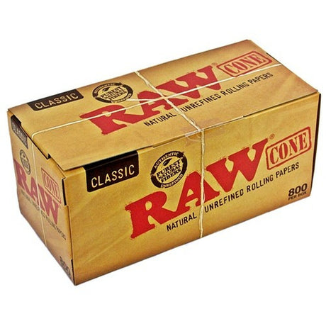 Front angled view of the RAW Classic Lean Bulk Cones 110mm 800-count box in natural kraft brown packaging. Made from unrefined plant fibers, these extra-slender 110mm cones feature a longer tip for a smoother, cooler smoke.