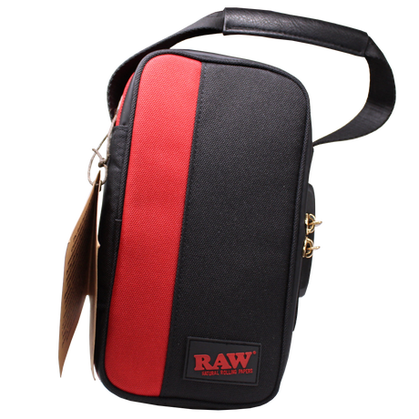 Angled front view of the RAW Dank Locker CarryRAWl travel bag in heather grey with black accents and brown carrying straps. This spacious, smell-proof duffel utilizes advanced carbon and foil lining to securely trap odors and keep your smoking essentials entirely discreet.