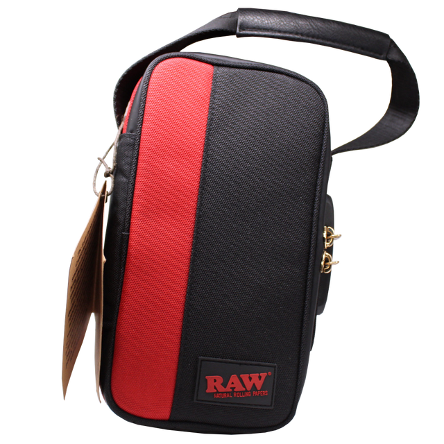 Angled front view of the RAW Dank Locker CarryRAWl travel bag in heather grey with black accents and brown carrying straps. This spacious, smell-proof duffel utilizes advanced carbon and foil lining to securely trap odors and keep your smoking essentials entirely discreet.