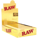 Front view of the RAW Ethereal 1 1/4 size rolling papers in a 24-count gold and black retail display box. These low-density, ultra-thin papers feature a clean tree sap adhesive and are engineered to minimize the taste of paper ash.