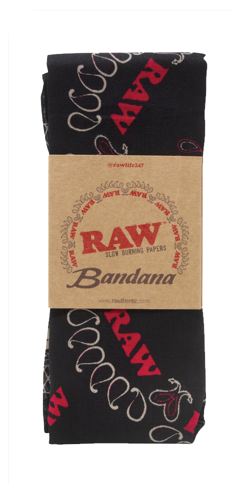 Top down flat lay view of the RAW Hemp Paisley Bandana in classic black with a distressed white paisley print pattern. This premium lifestyle apparel piece features custom branded graphics woven into the design, serving as a stylish headwrap or smoke shop wall hanging.