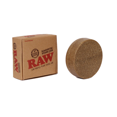 Front angled view of the RAW Magnetic Stash Jar in brown with a RAW logo on the lid. Featuring a strong magnetic base, this discreet, pocket-sized container easily attaches to metal rolling trays to prevent accidental spills of your botanical extracts.