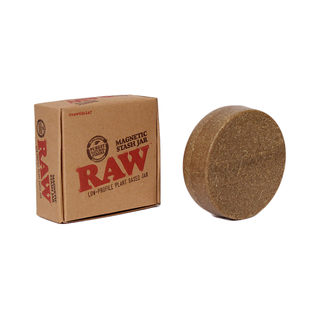 Front angled view of the RAW Magnetic Stash Jar in brown with a RAW logo on the lid. Featuring a strong magnetic base, this discreet, pocket-sized container easily attaches to metal rolling trays to prevent accidental spills of your botanical extracts.