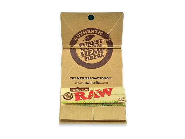 Front flat lay view of a single RAW Organic Hemp Artesano 1 1/4 booklet in natural tan. This comprehensive pack houses 50 unbleached organically grown hemp papers, a built-in pack of unrefined tips, and a magnetic closure to keep your rolling supplies securely locked together.