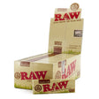 Front angled view of the RAW Organic Hemp Single Wide Papers 50-count display box in natural light brown packaging with green branding. Made from unrefined organically grown hemp, this retail-ready box provides smoke shops with an attractive countertop presentation.