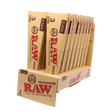 Angled overhead view of the open RAW Peacemaker cones display box revealing the individual 3-packs. The natural unbleached brown wrappers are capable of comfortably holding up to 2.25 grams of ground material.