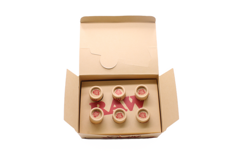 Angled overhead view of the open RAW pre-rolled rose tips box in kraft brown. These ready-to-use pre-rolled filters save consumers time while providing a rigid, structurally sound mouthpiece for custom rolls.