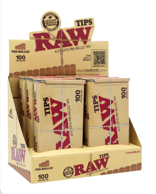 Front angled view of the RAW Pre-Rolled Tips Tin 6-pack display box in natural kraft brown packaging with red and black branding. This retail-ready counter carton neatly showcases these premium, reusable metal tins to boost point-of-sale impulse buys.