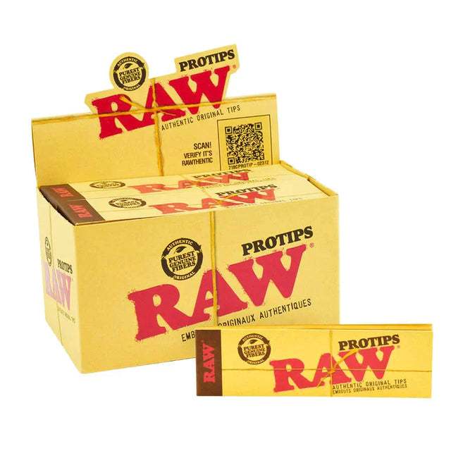 Angled overhead view of the RAW Pro Tips 24-count display box open in natural brown and red. Revealing the opened master carton, this view showcases twenty-four individual packs arranged neatly for easy browsing at the smoke shop checkout counter.