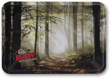 Front view of the RAW Smokey Forest mini rolling tray featuring a lush green and brown photographic scene of a misty woodland. This compact 7×5-inch metal tray provides an ultra-smooth, flat surface for neatly breaking down herbs and rolling custom papers.