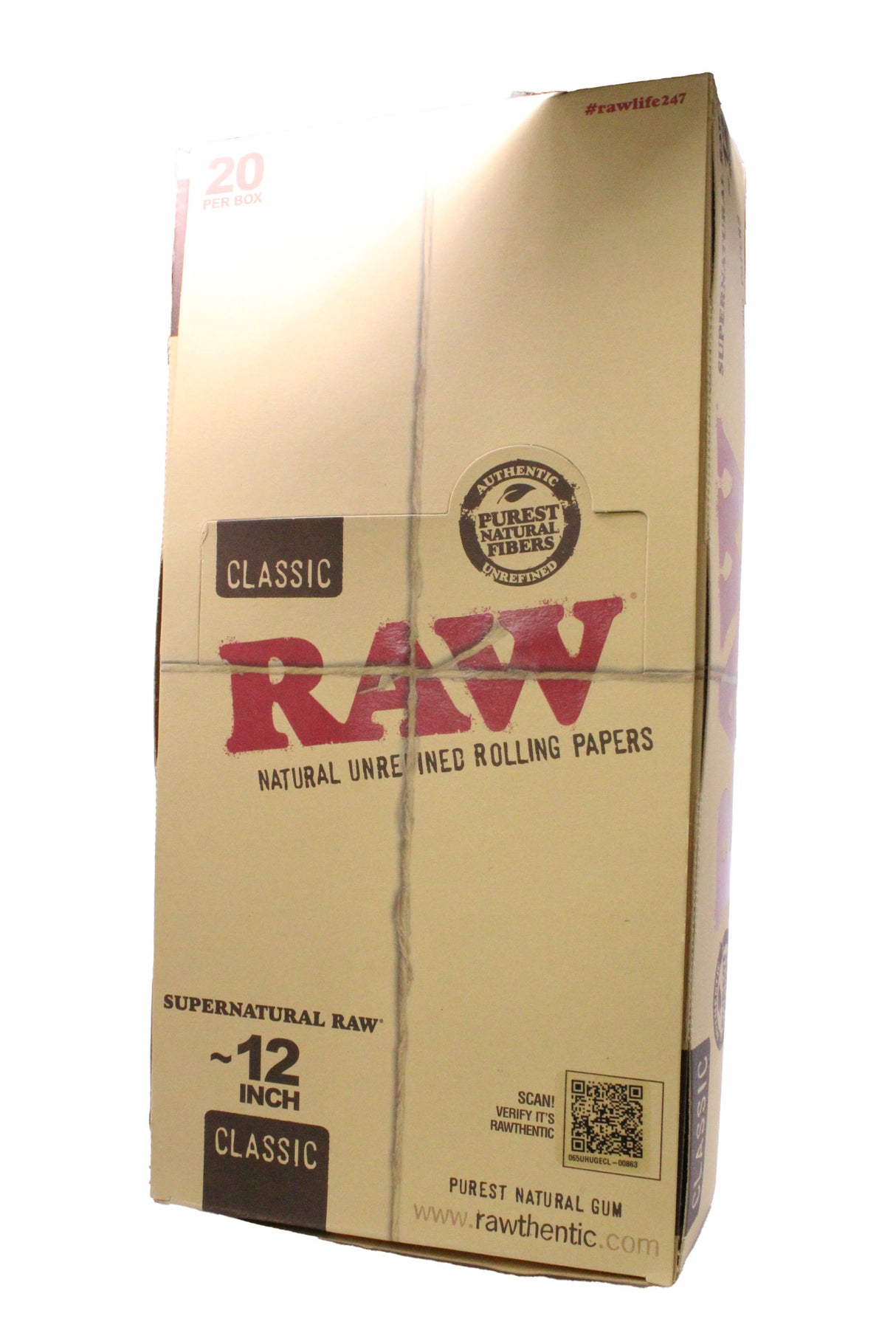 Angled overhead view of the RAW Supernatural 12-inch rolling papers display box showing the brown and red packaging. Crafted from natural unrefined plant fibers, they feature a proprietary criss-cross watermark to ensure a slow, even burn.