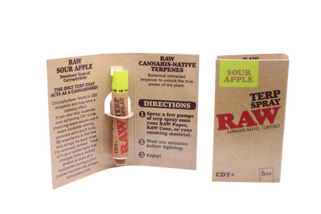 Angled overhead view of the open RAW Terpene Spray Sour Apple carton revealing the individual pocket-sized spray bottles. This fluid perfectly complements the user's chosen botanical material without introducing synthetic syrups.