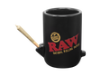 Front view of the RAW Wake Up Bake Up mug in matte black. This 2-in-1 ceramic coffee cup features a built-in dry herb bowl and mouthpiece, allowing users to sip their brew and smoke simultaneously for a relaxing morning routine.