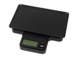 Angled front view of the RAW x My Weigh tray scale in its retail packaging. This multi-functional 1000g digital scale features a variable-sensitivity base explicitly contoured to hold the included metal mini rolling tray.
