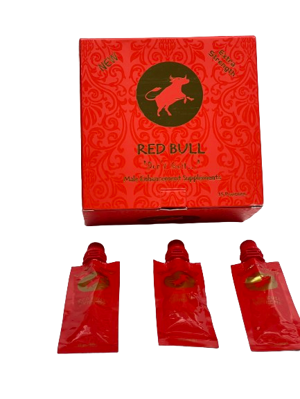 Angled overhead view of the Red Bull 10000K Extra Strength retail display box featuring matching red and gold. This professional wholesale countertop display container holds multiple individual blister cards for easy presentation in retail and smoke shop environments.