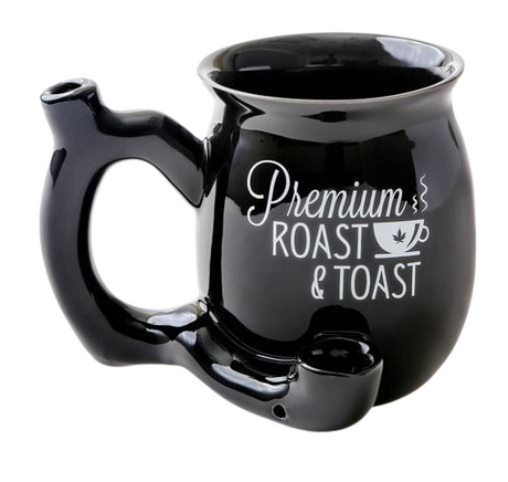 Front view of the Roast and Toast novelty mug pipe in black with white lettering. This 2-in-1 functional ceramic coffee mug features a built-in dry herb pipe for the ultimate wake and bake session.