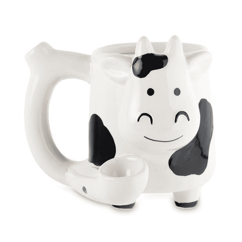 Front view of the Roast and Toast novelty mug pipe in the shape of a cow. This 2-in-1 functional ceramic coffee mug features a built-in dry herb pipe for the ultimate wake and bake session.