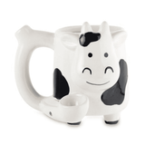 Front view of the Roast and Toast novelty mug pipe in the shape of a cow. This 2-in-1 functional ceramic coffee mug features a built-in dry herb pipe for the ultimate wake and bake session.