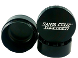 Front view of the Santa Cruz Shredder 3-piece medium aluminum grinder in matte black. This medical-grade aerospace aluminum grinder features a textured knurled grip and a strong magnetic lid for effortless, everyday shredding of your favorite dry herbs.