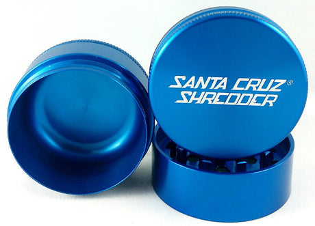 Front view of the Santa Cruz Shredder 3-piece medium aluminum grinder in metallic blue. This medical-grade aerospace aluminum grinder features a textured knurled grip and a strong magnetic lid for effortless, everyday shredding of your favorite dry herbs.