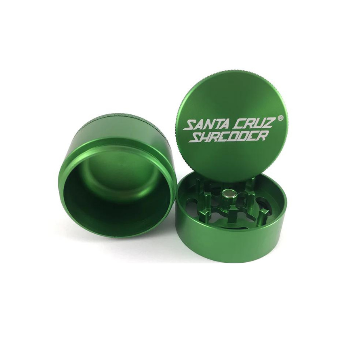 Front view of the Santa Cruz Shredder 3-piece medium aluminum grinder in metallic green. This medical-grade aerospace aluminum grinder features a textured knurled grip and a strong magnetic lid for effortless, everyday shredding of your favorite dry herbs.