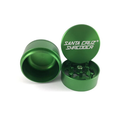 Front view of the Santa Cruz Shredder 3-piece medium aluminum grinder in metallic green. This medical-grade aerospace aluminum grinder features a textured knurled grip and a strong magnetic lid for effortless, everyday shredding of your favorite dry herbs.