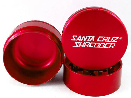 Front view of the Santa Cruz Shredder 3-piece medium aluminum grinder in metallic red. This medical-grade aerospace aluminum grinder features a textured knurled grip and a strong magnetic lid for effortless, everyday shredding of your favorite dry herbs.