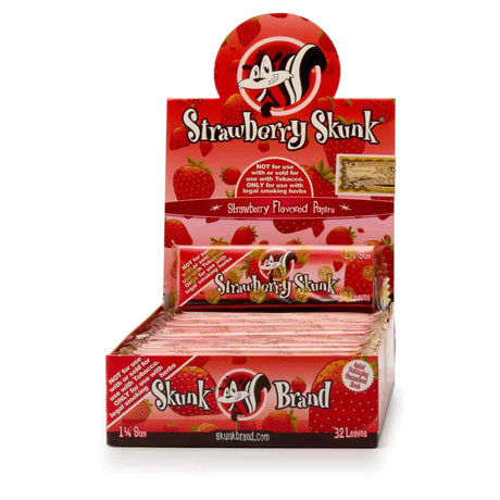 Front view of the Skunk Brand flavored rolling papers 1 1/4 size 24-count display box in a vibrant multicolored aesthetic with the iconic skunk logo. This wholesale countertop display case contains a sweet variety of slow-burning hemp papers designed to take the bite out of harsh herbs.
