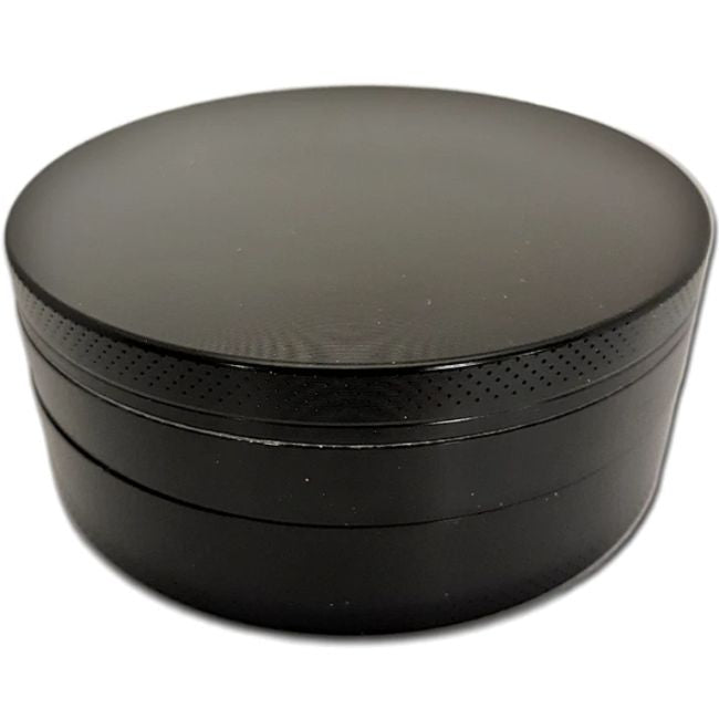 Side profile view of the Smoke Zilla Jumbo Aluminum Grinder 98mm in sleek metallic black. The durable exterior is crafted with textured ridges along the top and bottom lids to provide users with a non-slip grip for effortless twisting.