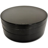 Side profile view of the Smoke Zilla Jumbo Aluminum Grinder 98mm in sleek metallic black. The durable exterior is crafted with textured ridges along the top and bottom lids to provide users with a non-slip grip for effortless twisting.